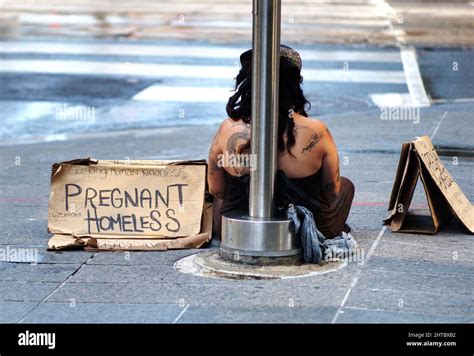 Pregnant Homeless Woman Asking For Help On A Street Stock Photo Alamy