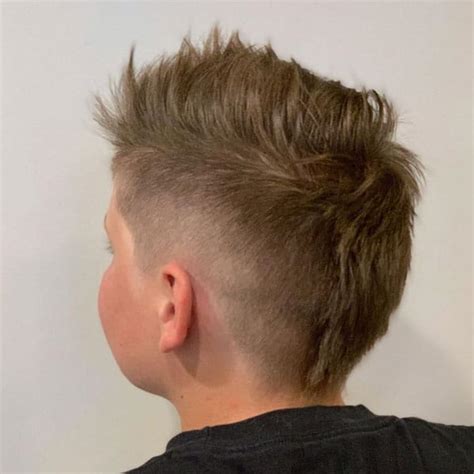 The sides are cut as short as possible with a mohawk section left on top for spiking. 25 Cool Kids Mohawk Ideas: The Best Little Boy Mohawk ...