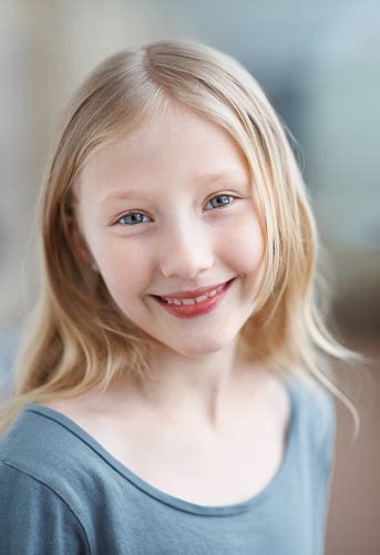 Beautiful Little Girl Giving You A Warm Smile Stock Photo