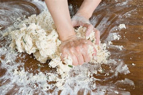 Woman Hands Kneading Dough For Making Bread By Stocksy Contributor