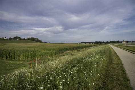 Nearby, but completely different in. Landscape by biking path under cloudy skies image - Free ...