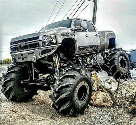 A Monster Truck Parked On Top Of A Pile Of Rocks