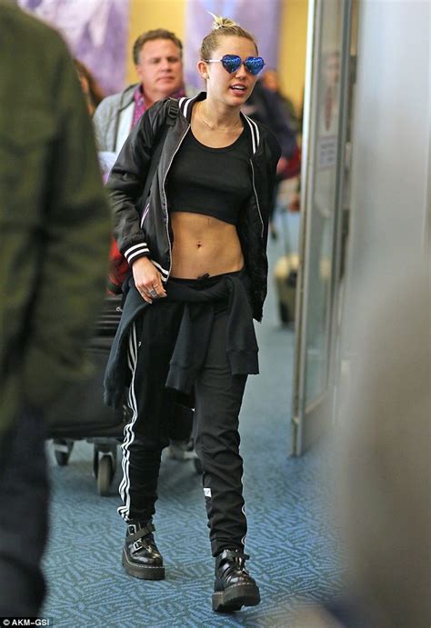 Braless Miley Cyrus Parades Taut Tummy In Black Crop Top Daily Mail