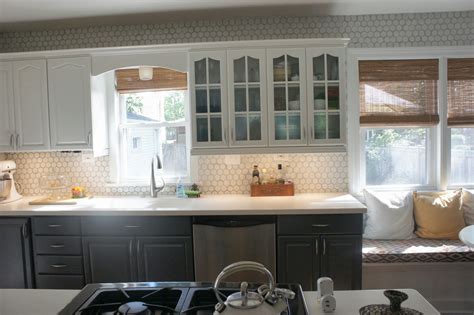 The darker tiles pop against stark white cabinets and draw your eye to. Remodelaholic | Gray and White Kitchen Makeover with ...