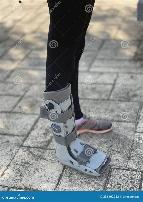 Orthopedic Boot Used In Rehabilitation For Walking Women With Leg