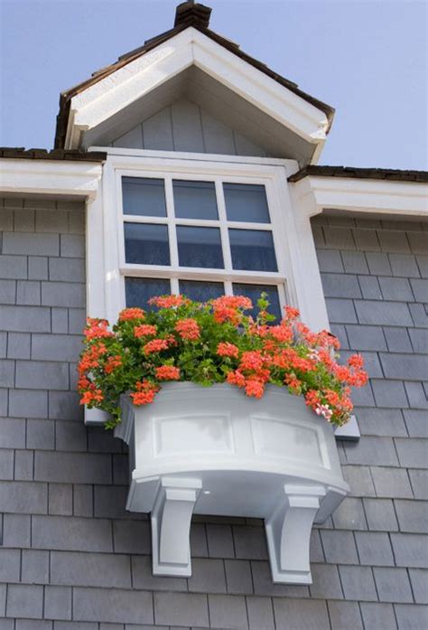 The wooden box above might be similar to many others in this list, but the brackets reflect a quirkiness for sure! Nantucket Window Box with Decorative Brackets | Exterior ...