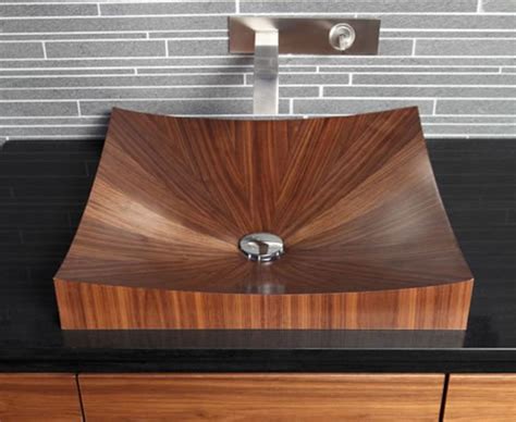 This particular wooden basin made in stone rain wood blends into the warm environment with its. 10 Dashingly Natural Wooden Bathroom Sinks - Rilane