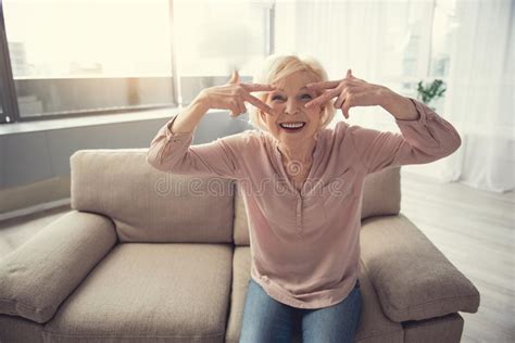 Optimistic Granny Sitting On Sofa Indoors Stock Image Image Of Casual
