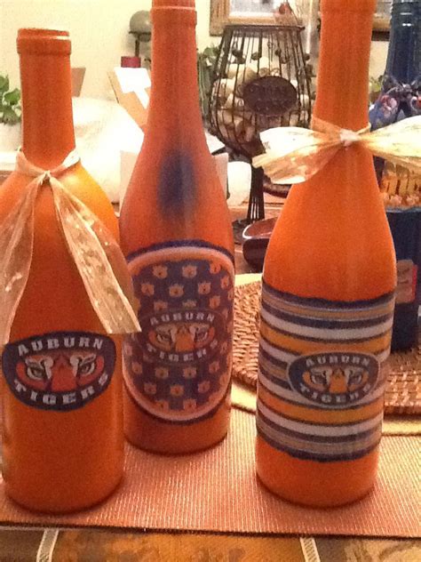 Instead of tossing those old wine bottles, use them in a variety of wine bottle crafts. Auburn Wine Bottle Creations! | Bottles decoration, Wine ...