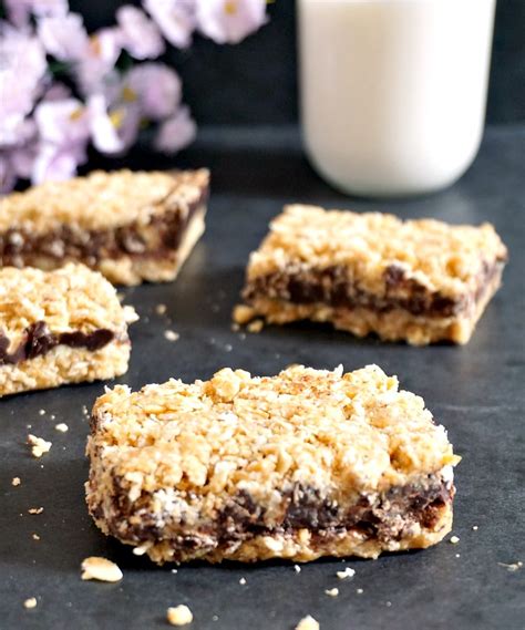 These easy chocolate oatmeal bars are thick, chewy, and require no baking! Healthy no-bake chocolate oat bars with peanut butter {V+GF}