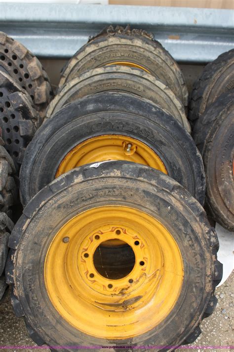 4 John Deere 10 165 Foam Filled Skid Steer Tires And Wheels In Paola