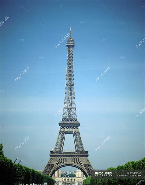 Low Angle View Of Eiffel Tower With Blue Sky On Background Paris
