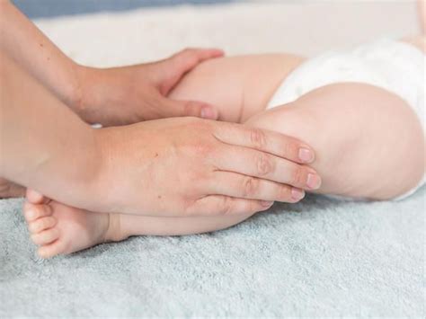 How To Massage Your Baby Stretching Photos Babycentre Uk Baby