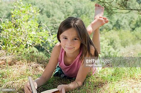 Girl Lying Barefoot Bildbanksfoton Och Bilder Getty Images