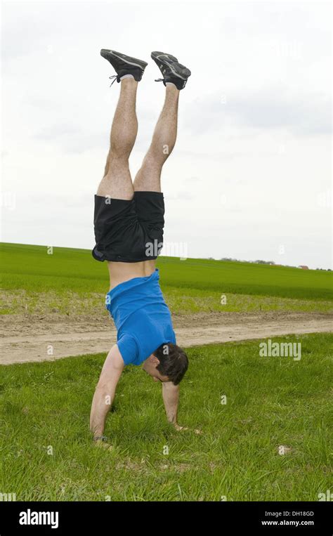 Handstand On A Meadow Stock Photo Alamy
