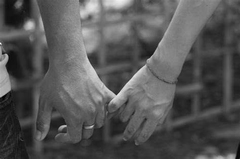 Two People In Love Holding Hands