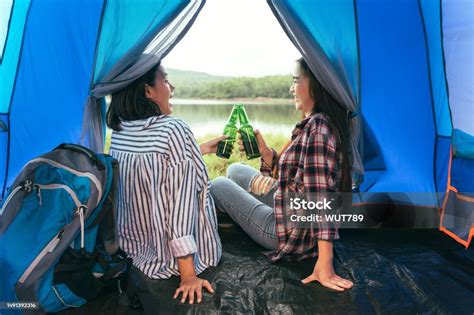 Asian Lgbtq Couples Drinking Drinks In A Romantic Atmosphere Inside A Camping Tent Lgbtq Couples