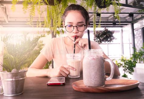 Asian Girl Sucking Coffee With Look Smartphone Stock Image Image Of