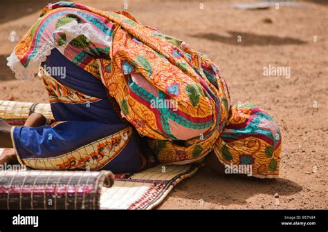 A Young Fulani Woman In Ouagadougou Burkina Faso Touches Her Forehead