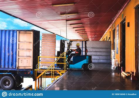 Forklift Stuffing Unstuffing Pallets Of Cargo To Container On Warehouse