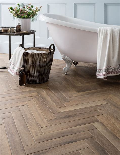 Place a simple vanity in warm wood tones against a honeycomb of blue and white small wall tile for an unexpected touch of charm to your bath. Great Tile Ideas for Small Bathrooms | Wood effect tiles ...