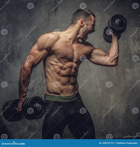 Screaming Shirtless Muscular Male Working Out With Dumbbells Stock Image Image Of Male