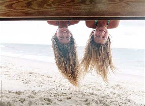 portrait of two girls upside down by stocksy contributor raymond forbes llc stocksy