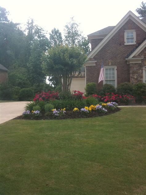 These people turned their front yards into driveways. landscaping the corner where the driveway + sidewalk meet ...