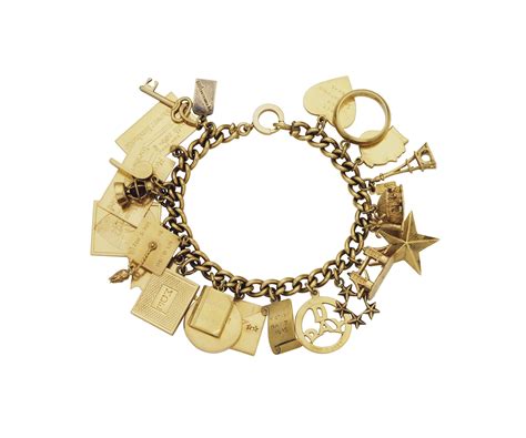 A GOLD CHARM BRACELET | Christie's