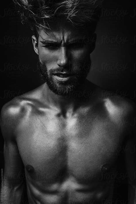 Muscular Shirtless Man In Dark Background By Stocksy Contributor