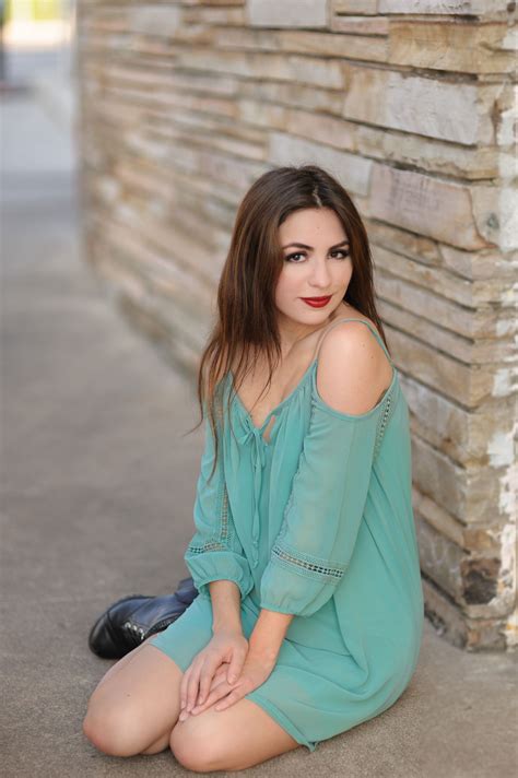 Portrait Of A College Senior Girl Wearing A Blue Dress On South Congress College Senior