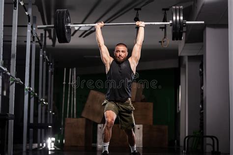 Athlete Lifting Barbell Silhouette Of A Muscular Man Stock Image
