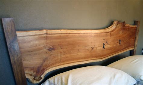 Learn how to make a diy rustic headboard you won't believe you made yourself! Raw wood headboard. We have a piece like this I've been trying to figure out what to do with ...