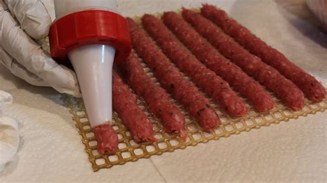 Load the mixture in the jerky gun and use the gun to load your dehydrator trays. Easy to Make Beef Jerky with Ground Meat - YouTube