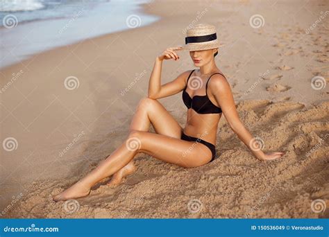 Beautiful Woman Apply Sun Protection Cream On Her Smooth Tanned Legs