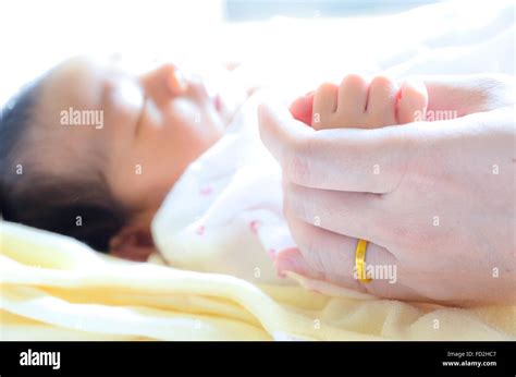 Sleeping Baby Holding Mothers Finger Hi Res Stock Photography And