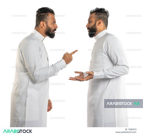 Portrait Of Two Saudi Arabian Gulf Arab Twin Men Standing Opposite Each