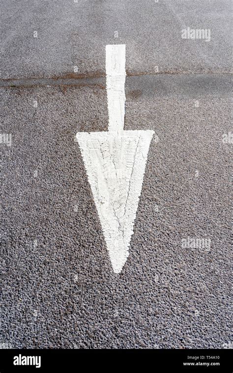 White Painted Arrow On Road Surface Stock Photo Alamy