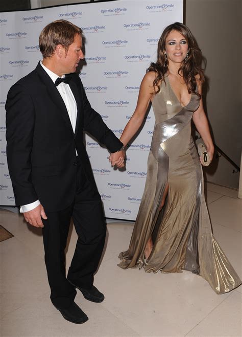 Elizabeth Hurley Cleavage And Leggy Candids At Operation Smile Ball