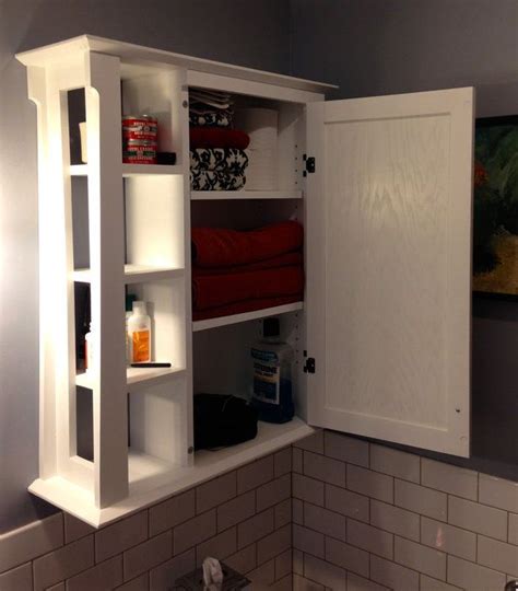 It has a crown top, 3 open front shelves and a back with a vertically. 17 Best images about Wall Mounted Bathroom Cabinets on ...