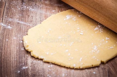 Fresh Raw Cookie Dough And Rolling Pin On Wooden Table Stock Image
