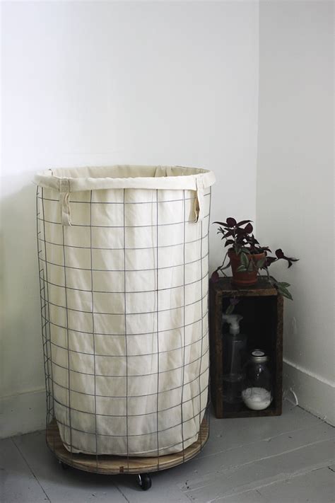 First cut out 2 rectangles that measure 22 in x 29 in and then 1 circle that's 18 in diameter from the outside fabric. DIY Wire Laundry Hamper - The Merrythought
