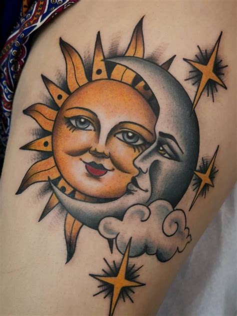 A Sun And Moon Tattoo On The Back Of A Woman S Thigh With Stars Around It