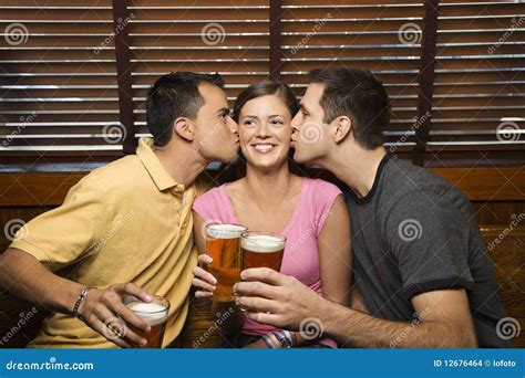 Two Men Kissing Young Woman Stock Photo Image Of Friend Drinking