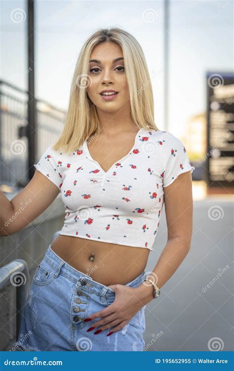 A Young Lovely Blonde Model Poses Outdoors While Enjoying A Summers Day Stock Image Image Of