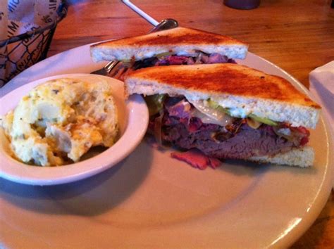 Italian beef panini roast beef, provolone, bell peppers and onion on sourdough. Smoked Cuban sandwich (pork, ham, Swiss cheese, sweet pickles, grilled onions, mayo & mustard on ...