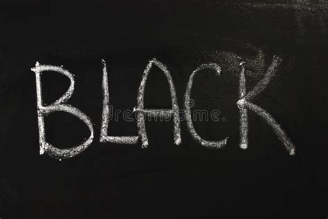 The Word Black Written In White Chalk On A Black Chalkboard Stock Photo