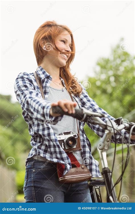 Readhead Standing Next To Her Bike With A Camera Stock Image Image Of Person Pursuit 45098107