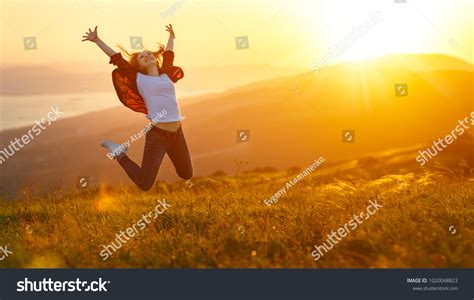 Happy Woman Jumping Enjoying Life Field Stock Photo 1020048823