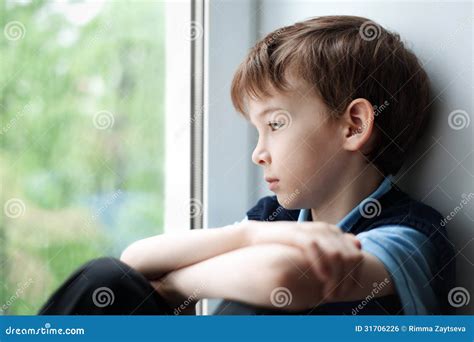 Sad Boy Sitting On Window Stock Photo Image Of Portrait 31706226